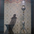 SFO Museum -- International Terminal @SFOMuseum exhibition #TheVictorianPaperedWall Exoticism period 1837-1901.  Turkish folding chair circa 1880s caught my eye, beside Piano Lamp circa 1875 designed by Edward C. Moore for Tiffany & Co, in front of Persian Wall Fill and Fringe 2021 by Bradley & Bradley .  Arrived at airport early for 7am flight to return to Eastern Time, terminal is mostly deserted and United Club lounge isn't yet open.  (SFO International Terminal G, San Francisco, California) 20211231