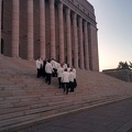 White suits on parliament steps