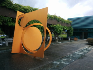 Orange sculpture on west plaza outside IBM Almaden shows up on rare drizzly day in the south peninsula. (San Jose, CA) 20140425
