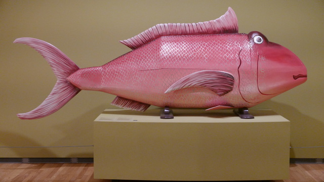 Large enough for a human corpse, Eric Adjetey Anang (2017) Fish Coffin was part of a Stanley Museum exhibition of fantasy coffins. Figurative coffins celebrate the profession, status, or accomplishments in Ghana. An aquatic theme is appropriate for sea-related occupations. (Stanley Museum of Art, West Burlington Street, University of Iowa, Iowa City, Iowa) 20250412 P1070880.JPG